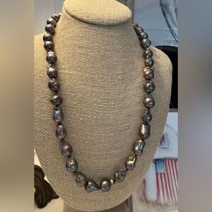 Beautiful peacock colored baroque, pearl necklace 24 inches long sterling clasp.